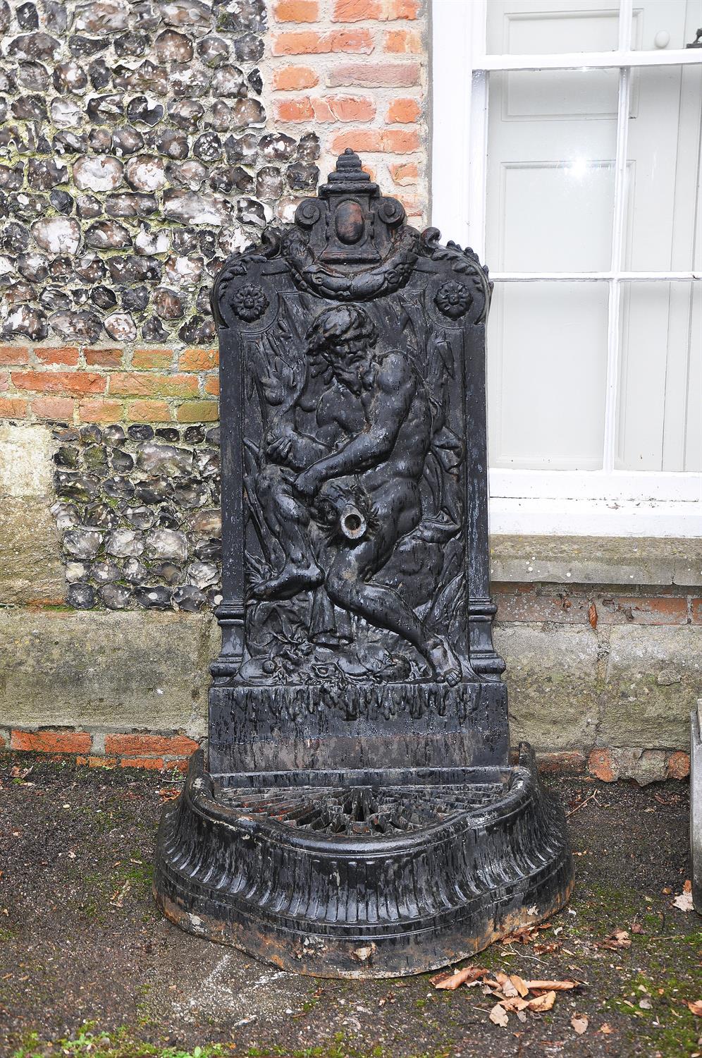 A painted cast iron wall fountain to a model by Val d'Osne