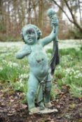 A verdigris patinated bronze model of a torch-bearing putto