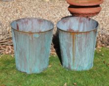 A pair of verdigris copper buckets or planters