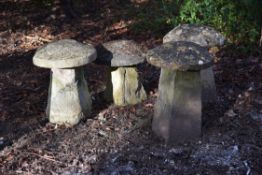 A group of four carved staddle stones