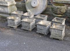 A set of eight stone composition planters in Neoclassical style