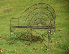 A black painted wirework garden bench