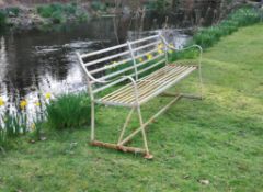 An English white painted wrought iron garden bench