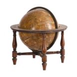 A Regency twelve inch celestial library table globe