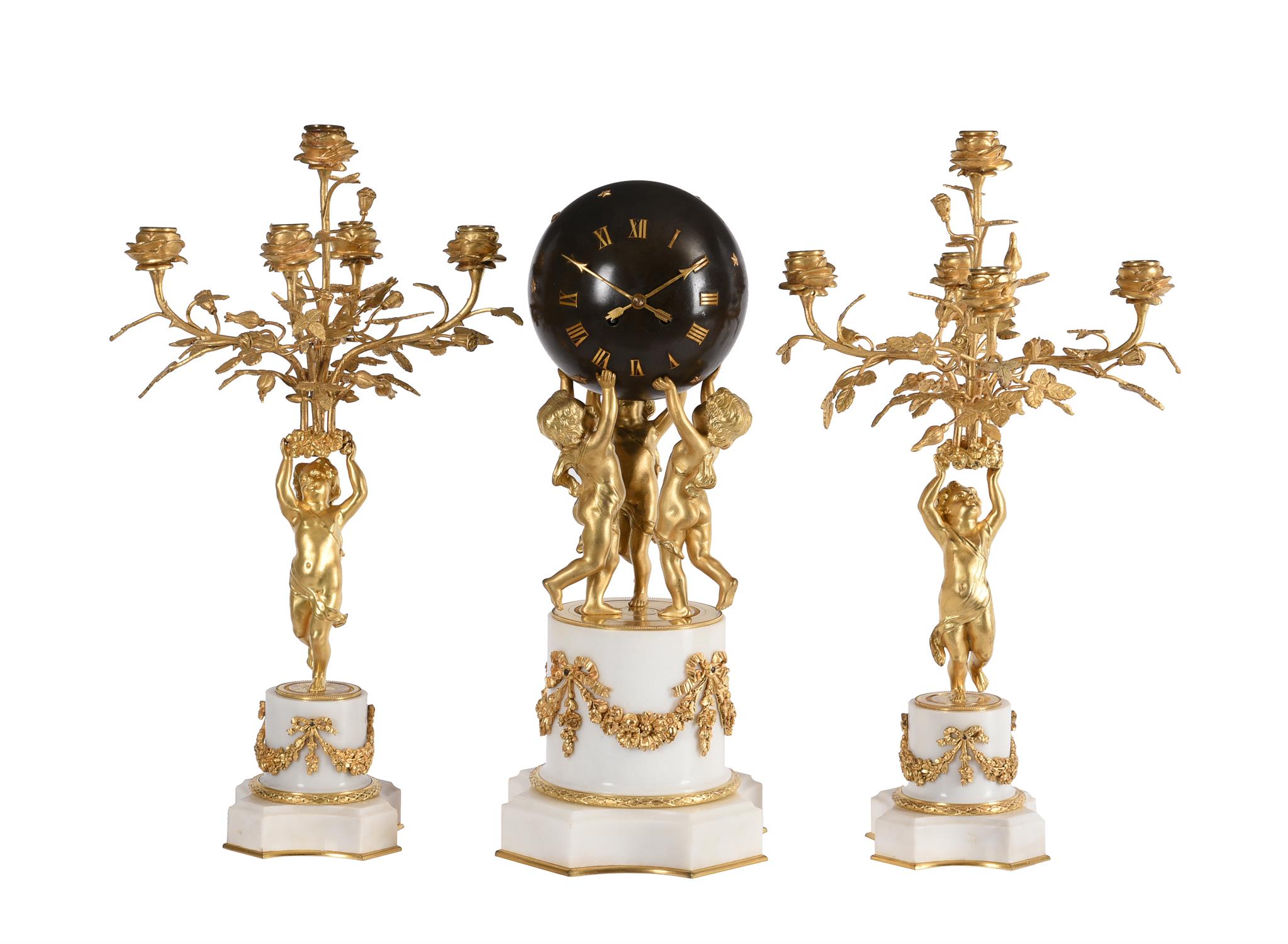 A French Louis XVI style ormolu and white marble mantel clock garniture