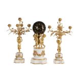 A French Louis XVI style ormolu and white marble mantel clock garniture