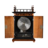 A walnut vertical Buffet type cabinet music box with 11 inch discs