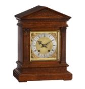 A German oak quarter-striking bracket clock