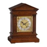 A German oak quarter-striking bracket clock