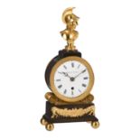 A Regency ormolu and patinated bronze figural mantel timepiece