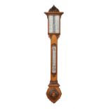 A Victorian carved oak mercury stick barometer