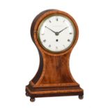 A George III kingwood crossbanded mahogany balloon-shaped table timepiece with fired enamel dial