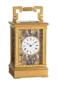 A fine French gilt brass carriage clock with multi-colour relief cast panels and push-button repeat