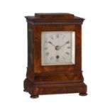 A Victorian figured mahogany small four-glass library mantel timepiece