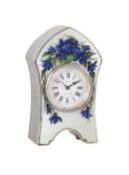 An Edwardian polychrome floral enamelled engine-turned silver small boudoir timepiece