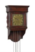 A George III stained pine hooded wall alarm timepiece