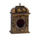 An unusual black japanned watch stand in the form of a miniature table clock