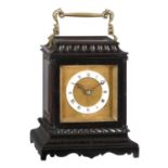 An ebonised carriage clock