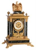 A French ormolu and verde antico marble mantel clock in the Empire taste