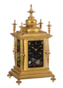 A French relief sculpted pietra dura hardstone panel mounted gilt brass mantel clock