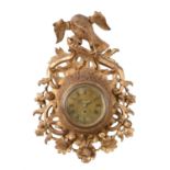 A George III giltwood cartel wall timepiece with seven inch dial