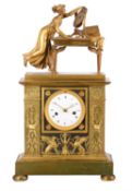 A fine French Empire ormolu and patinated bronze figural mantel clock