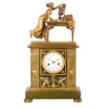 A fine French Empire ormolu and patinated bronze figural mantel clock