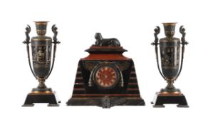 A French Egyptian revival bronze mounted marble mantel clock garniture