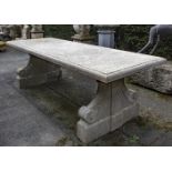 A carved limestone refectory garden table