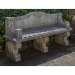 A carved limestone garden seat in 18th century style