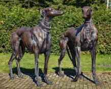 A near pair of bronze models of standing greyhounds