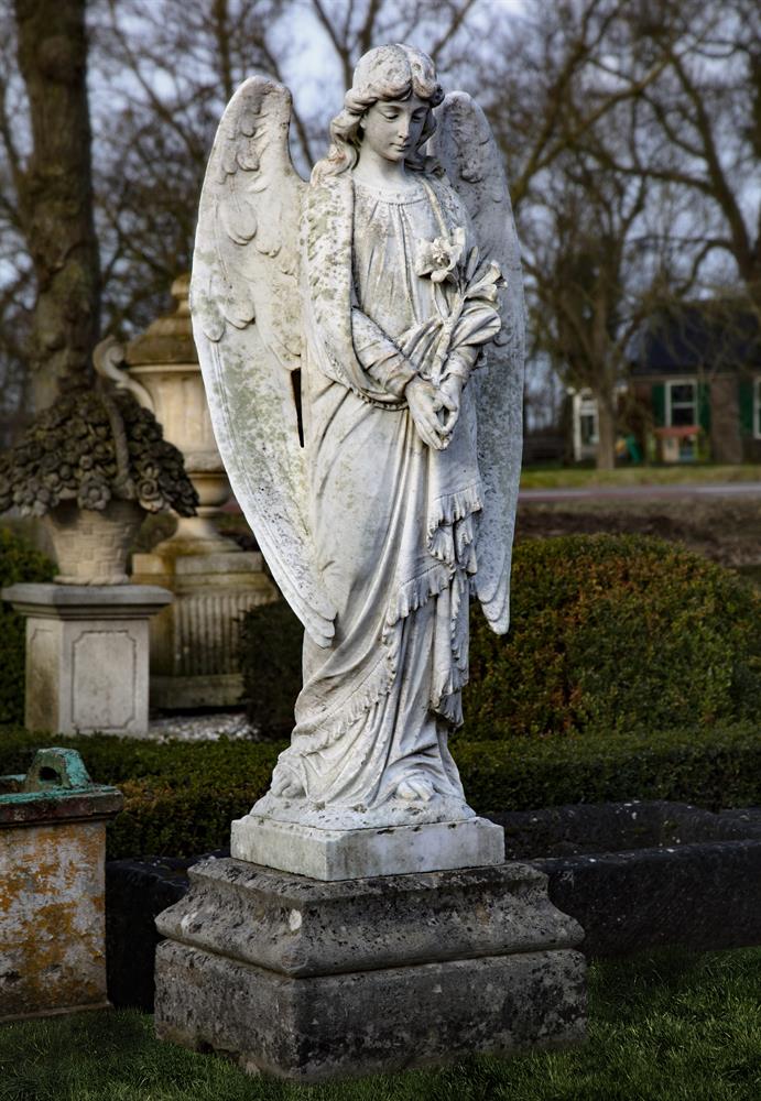 A Continental sculpted white marble model of an angel