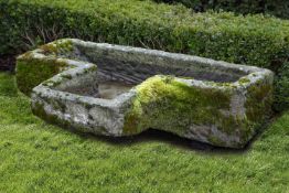 A carved limestone trough