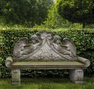 A carved limestone garden bench in Louis XIV style