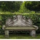 A carved limestone garden bench in Louis XIV style