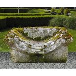 A carved limestone garden bench