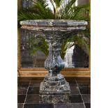 A carved green marble fountain