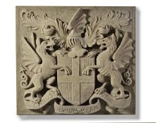 A sculpted limestone armorial panel