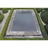 An ashlar cut Bourgogne stone rectangular pool surround