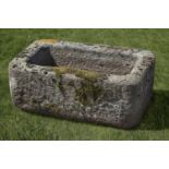 A carved limestone trough