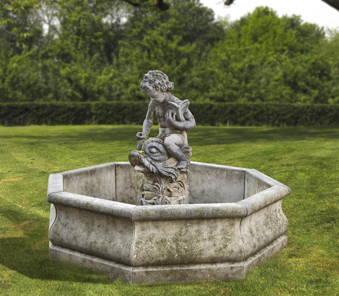 A Continental sculpted composition stone figural garden fountain