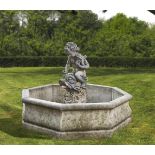 A Continental sculpted composition stone figural garden fountain