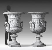 A pair of monumental Italian sculpted white marble urns in the manner of the Medici Vase