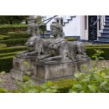 A pair of substantial sculpted limestone models of recumbent female sphinges