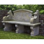 A carved limestone garden seat in 18th century style