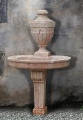 A Continental carved pink limestone fountain