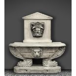 A sculpted white marble wall fountain and basin in the Renaissance style