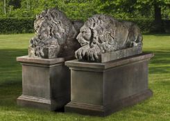 A pair of sculpted limestone models of recumbent lions