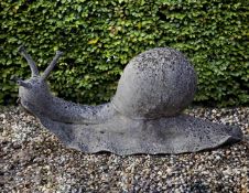 A sculpted limestone model of a garden snail