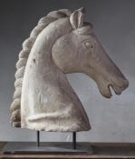 A sculpted limestone model of the head of a horse